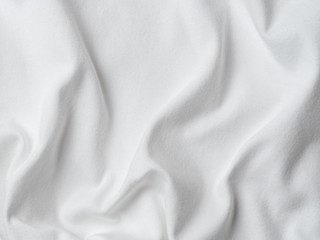 Obraz premium White cotton fabric texture. Clothes cotton jersey background with folds