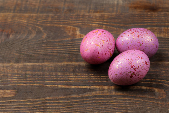Easter. Pink easter eggs on a brown wooden table. Happy easter. holidays