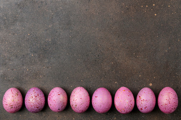 Easter. pink easter eggs on dark background. frame of eggs. Happy easter. holidays. top view. free place