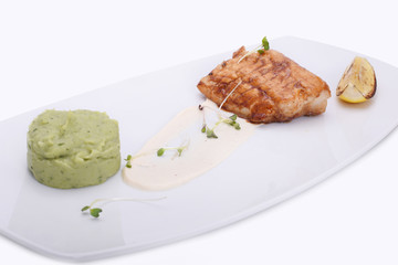Fish dish - fried fish fillet and mashed potatoes with spinach