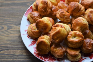 Fresh salt cake with cheese on a wooden table