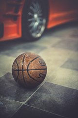 basketball in front of a car