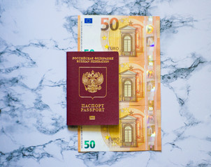Russian passport with euro on marbel background