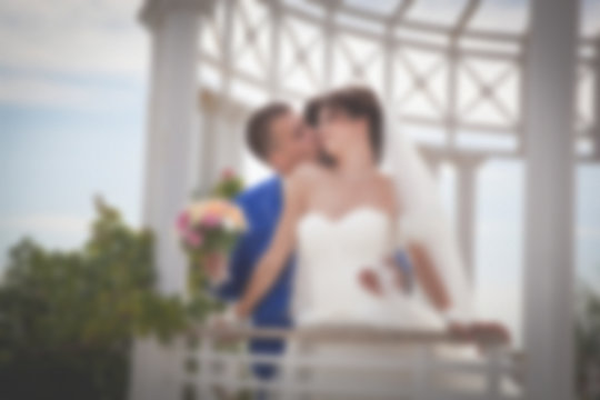 Blurred image background wedding theme on the beach, embankment young couple.