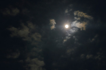 Fototapeta na wymiar night sky with clouds and sun