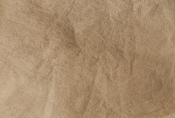 Brown textured flat paper with natural geometric shape.
