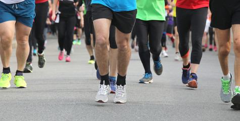 Legs of runners at marathon race