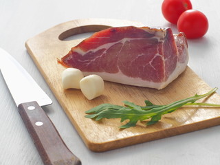 Slovenian or Croatian prsut with fresh cheese and greenery. Mediterranean breakfast. Selective focus.