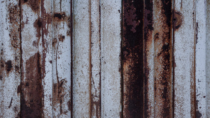 background of a vertically striped rusty weathered metal surface