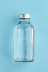 Medical bottle on blue background
