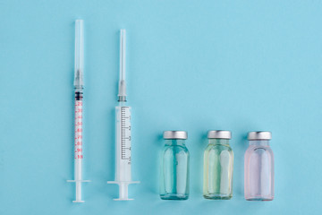 Syringes and assorted vaccine vials