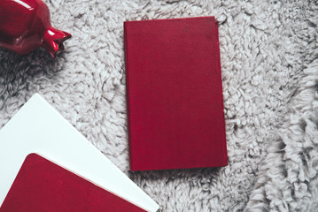 Top view of workplace: closed book, diary