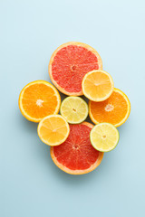 Colorful sliced fruits on blue background