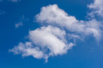 blue sky background with tiny clouds