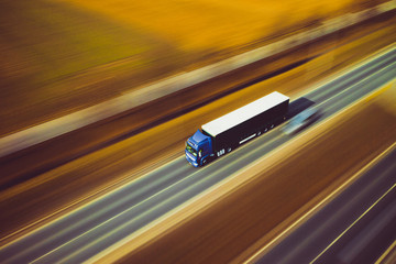 Fototapeta na wymiar White blue truck speed transport goods highway street motorway