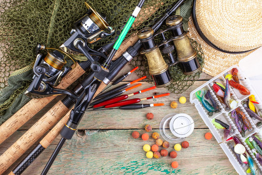 fishing tackle on a wooden table. 