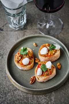 Bruschetta with garlic, ratatouille vegetables, mozzarella and walnut