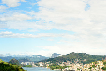 Aerial view of the beautiful city of Vitoria, Espirito Santo, Brazil and its wide bay. The city developed with its high buildings growing on the hills and into the local greenery