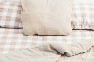 light linen bedclothes on bed