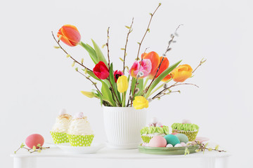 Easter arrangement with tulips and cupcakes
