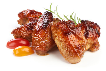 Roasted Buffalo chicken wings with barbecue sauce, american food, close-up, isolated on white background
