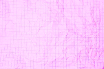 One crumpled pink blank paper sheet of a notebook  in grid (background)