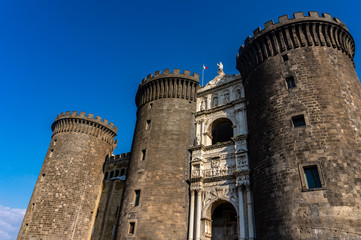 Medieval castle Maschio Angioino in a summer day in Naples