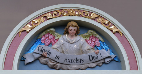 Angel with Gloria in excelsis Deo Banner, Nativity Scene, altarpiece in the church of Saint Matthew in Stitar, Croatia - obrazy, fototapety, plakaty