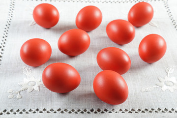 Colourful Easter eggs on ornated linen cloth