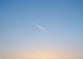 Airplane track in the blue sky