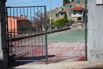 the iron gate of access for the soccer field of the country