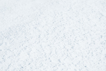 Fresh snow background texture. Winter background with snowflakes and snow mounds. Snow lumps.
