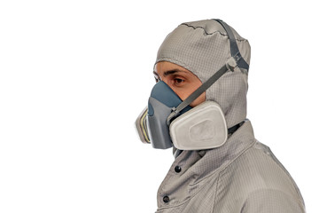 production worker in protective clothing, mask and glasses