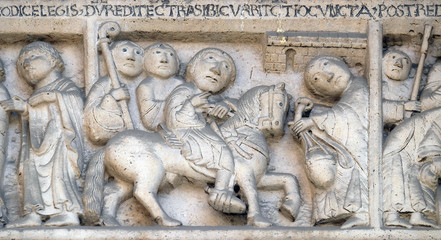 Scenes from the life of St. Geminiano: return from the journey of San Geminianus  to the east, bass relief by Wiligelmo, Modena Cathedral, Italy 