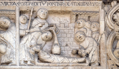 Scenes from the life of St. Geminiano: The death of St. Geminianus , bass relief by Wiligelmo, Modena Cathedral, Italy 
