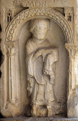 Fototapeta na wymiar Deacon, bass relief by followers of Wiligelmo, Princes’ Gate, Modena Cathedral, Italy 