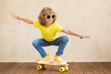 Happy child having fun on summer holidays © Igor Yaruta