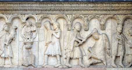 Plate with stories from Genesis: Story about Abel and Cain, The sacrifice of Cain and Abel, Cain kills Abel, God the Father reproaches Cain, relief by Wiligelmo, Modena Cathedral, Italy 