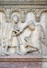 Plate with stories from Genesis: Story about Abel and Cain, Cain kills Abel, relief by Wiligelmo, Modena Cathedral, Italy 