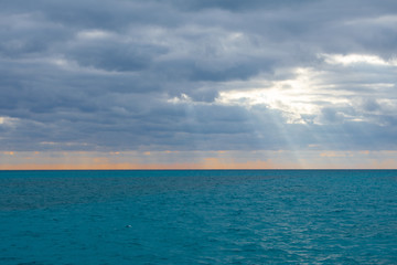 Naklejka na ściany i meble Calm sea w.ater against cloudy and sunny sky. Caribbean Sea in Tulum, Mexico 