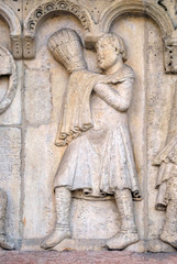 Plate with stories from Genesis: Story about Abel and Cain, The sacrifice of Cain and Abel, relief by Wiligelmo, Modena Cathedral, Italy
