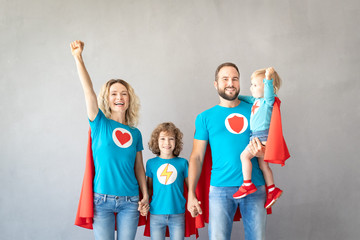 Fototapeta premium Family of superheroes playing at home