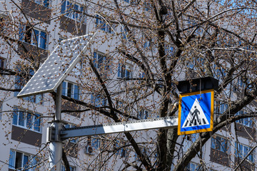 Sign of crossing of pedestrians with lights activated by a solar panel display in Bucharest,...