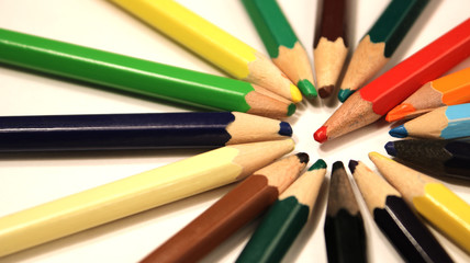 Fototapeta premium Colored pencils close up in macro photography. Art set of pencils with free space.