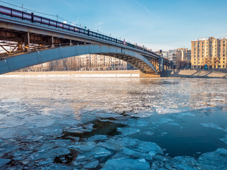 Obraz premium City skyline Moscow with a river at winter time. Shattered ice on the Moscow river at winter time