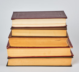 Fototapeta premium stack of books in hardcover and yellow pages