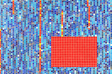 On the wall lined with blue ceramic mosaic the selected fragment is lined with red mosaic.