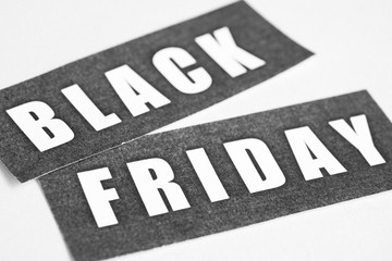 The inscription "black friday" on paper. Black and white photo.