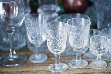 Several Crystal glasses are on the shelf