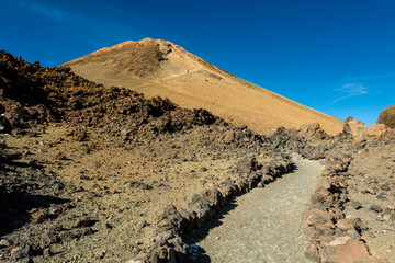 Majestic volcanic cone rising above spectacular lava shaped landscape.
